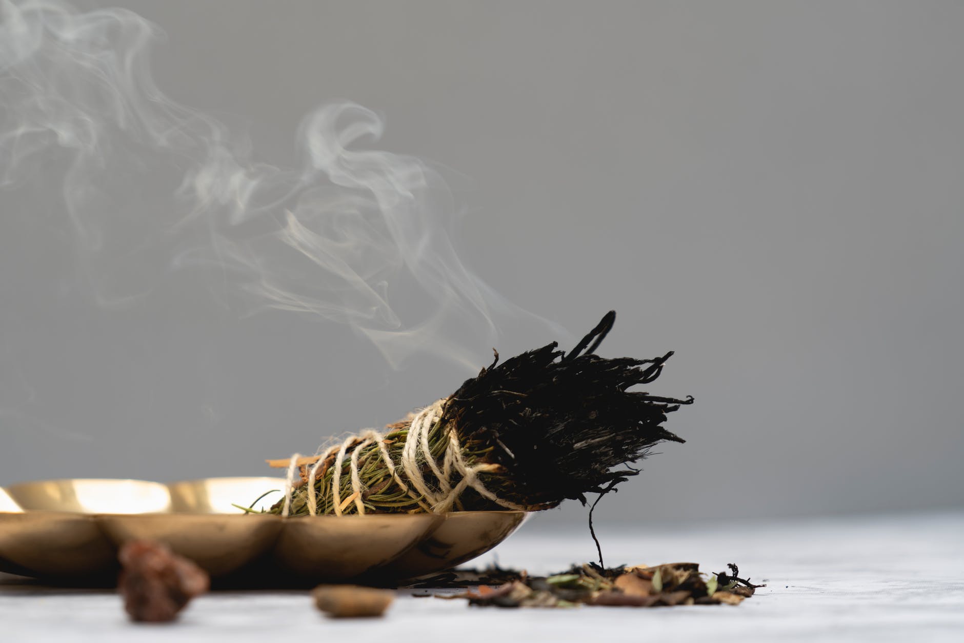 a bundle of sage smoking